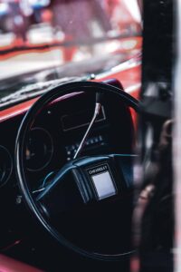 Chevrolet Car Interior with Black Steering Wheel Chevrolet vehicle interior showing black steering wheel and dashboard with red accents.
