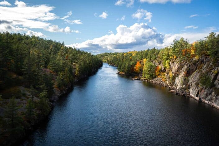 A view of the French River from the Suspension bridge at the beginning of Autumn